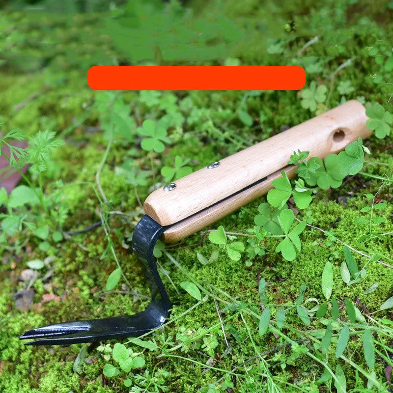 Carbon steel garden weeding and seedling rooting device 20 cm length on soil background