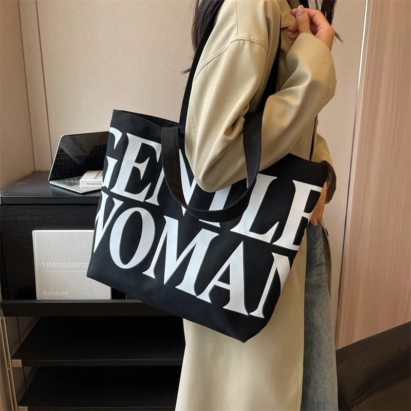 Large capacity canvas tote bag with letter print and upgraded zipper, off-white colour, on plain background