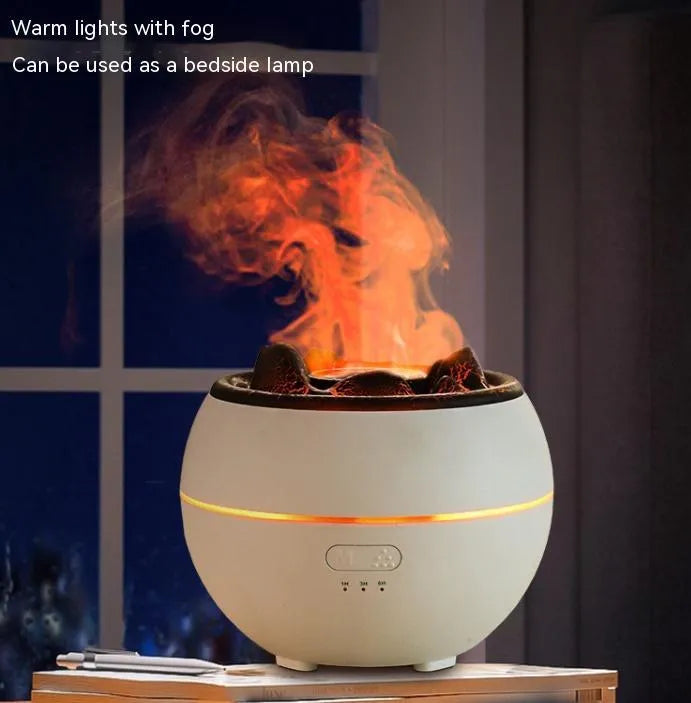 Round white ultrasonic flame aroma diffuser with water tank on desk