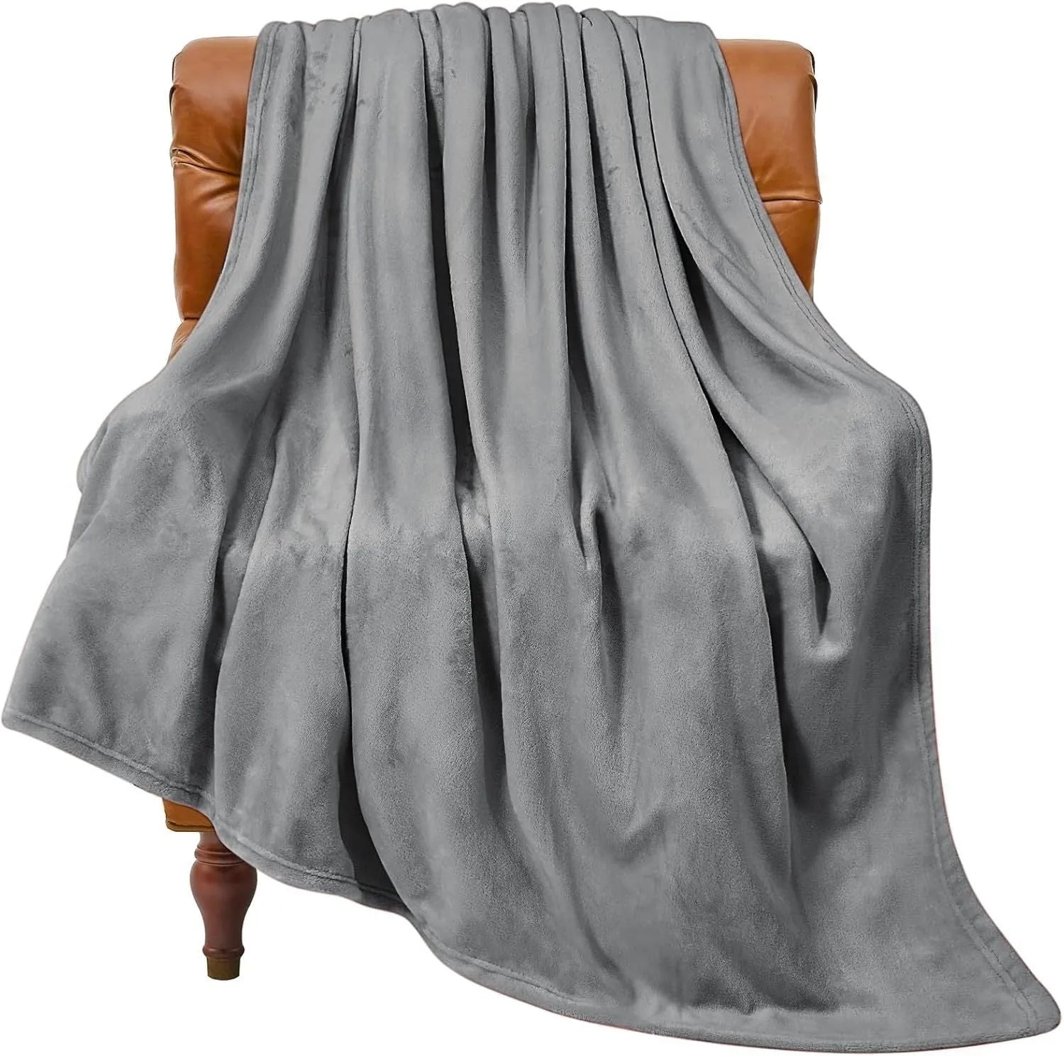 Light gray coral flannel polyester air conditioning blanket folded on a neutral background