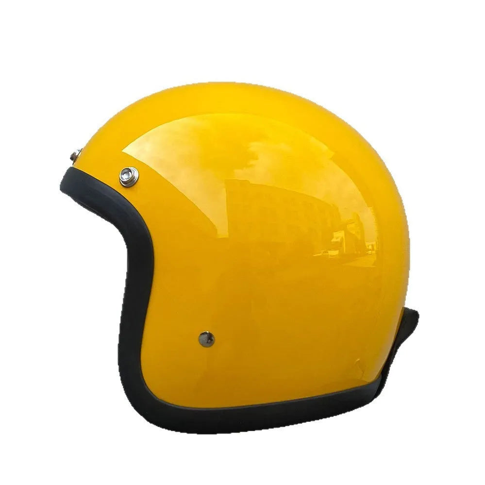 Retro-style open-face motorcycle helmet in matte black with floral design, showing clear visor and interior padding.