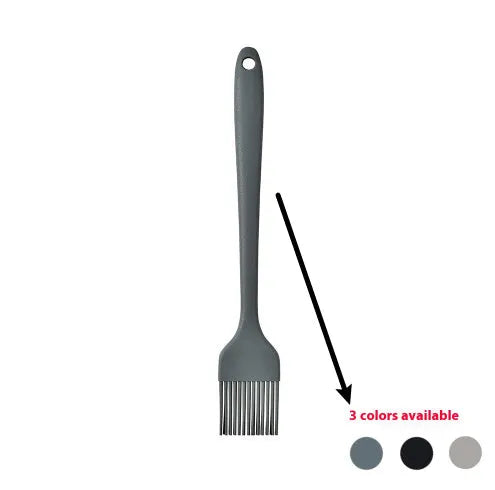 Silicone kitchen utensil set with twelve tools in a rotating white storage caddy on a counter.