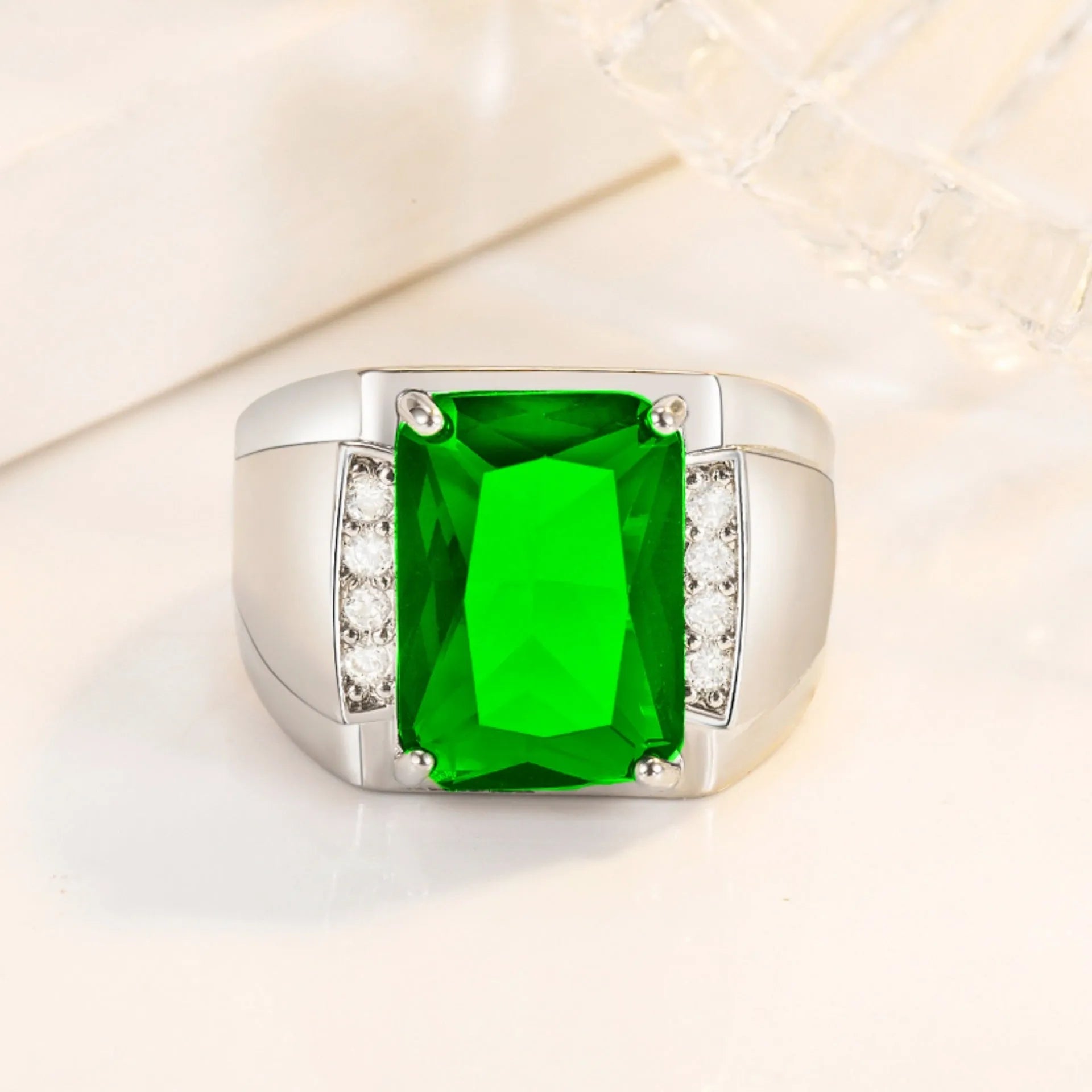 Adjustable geometric copper ring with a choice of coloured synthetic rhinestones on a white background.