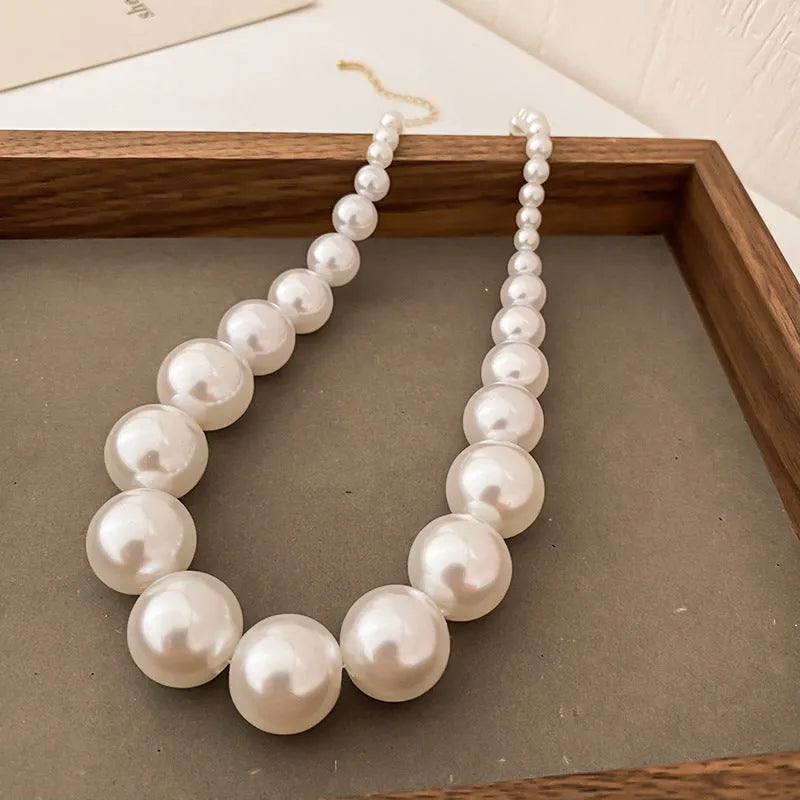 French retro gradient white imitation pearl necklace with U-shaped drape and ball bead chain for women