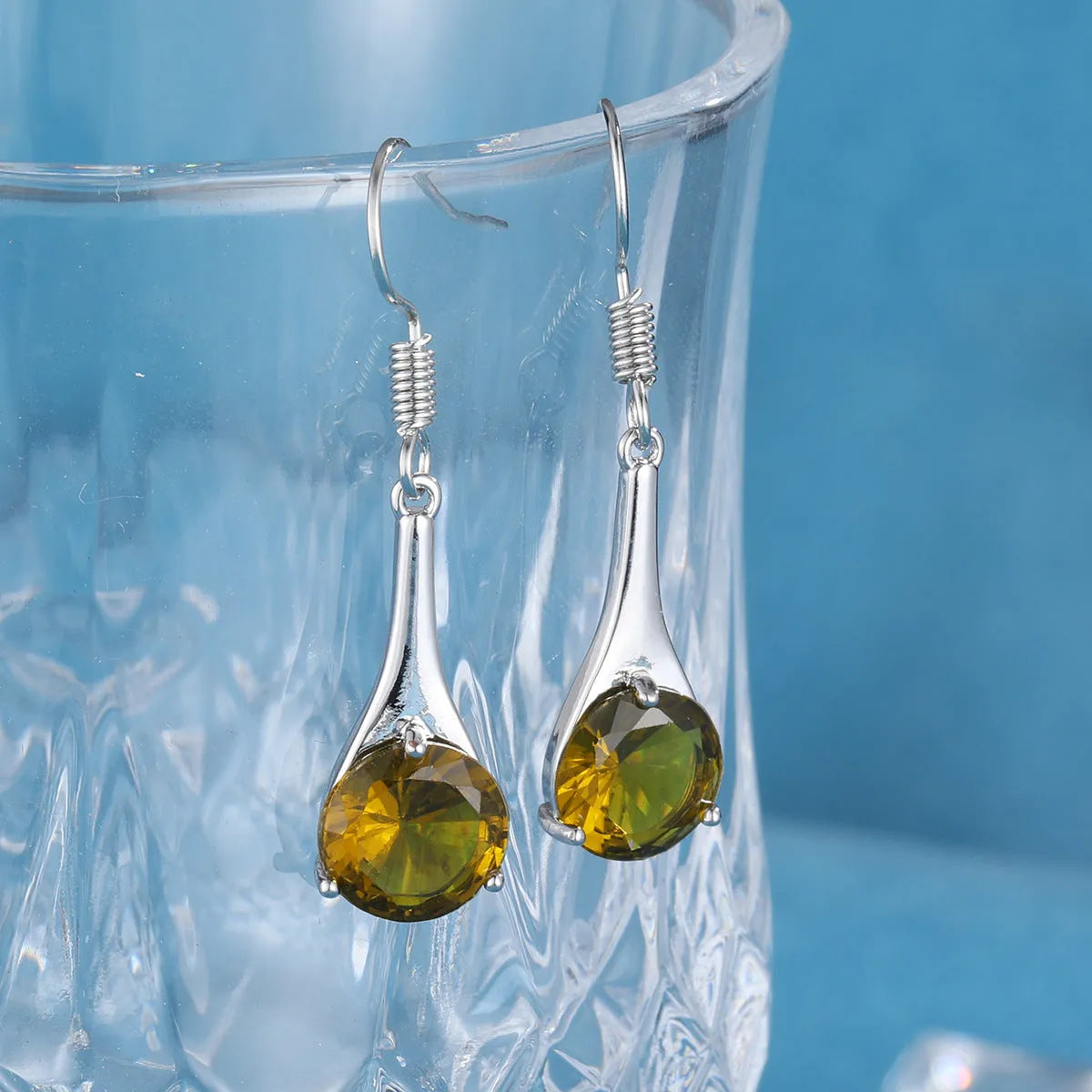 Olive green topaz drop earrings with water drop shape and electroplated alloy construction