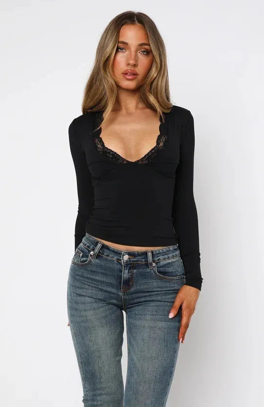 Women's black slim-fit pullover top with lace floral detailing and long sleeves