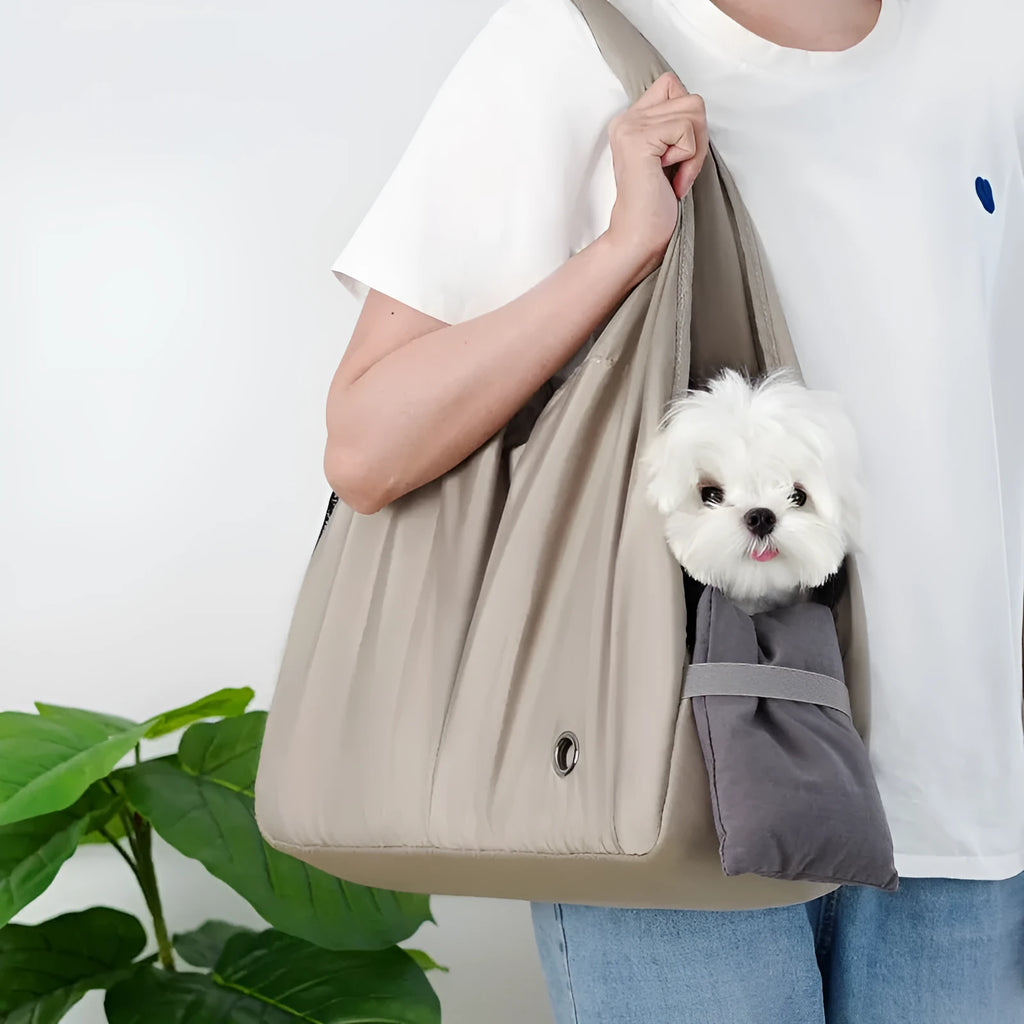 Apricot coloured cloth pet handbag carrier for cats or small dogs.