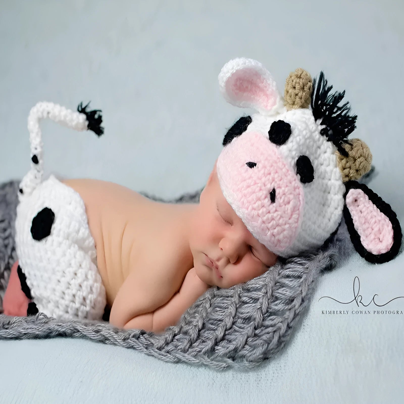 White hand-knitted baby cow suit set with hat and pants made from wool cotton blend
