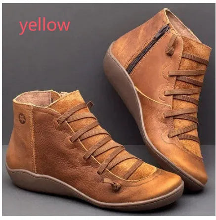 Women's casual flat boots with a wedge heel and round toe in various colours.