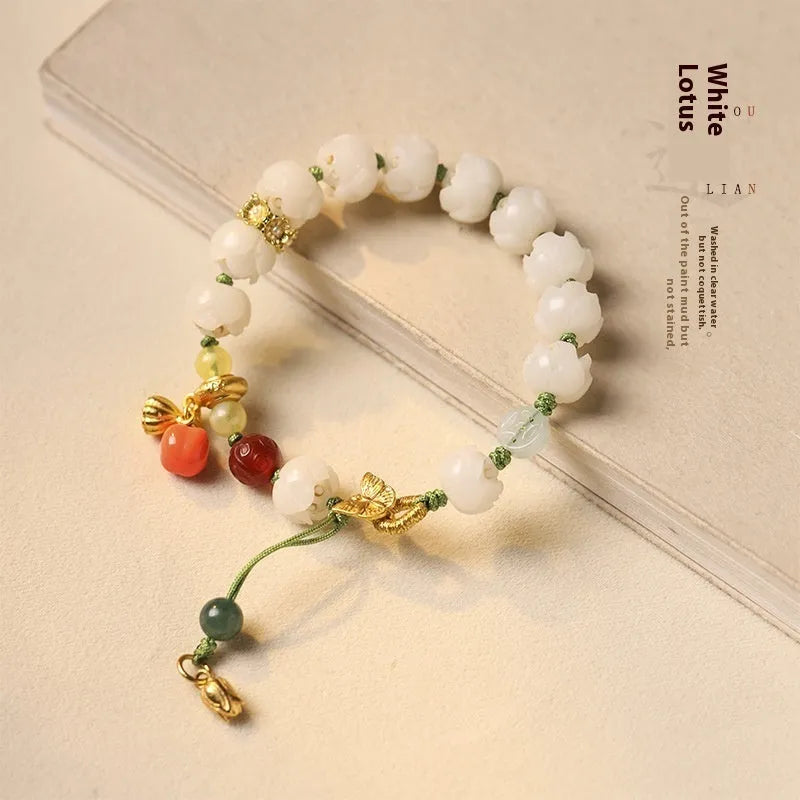 Hand-woven white jade bodhi bracelet with lotus and large pumpkin beads on a single ring open rope.