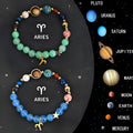 A set of two natural stone beaded bracelets with engraved zodiac sign charms on a textured background.