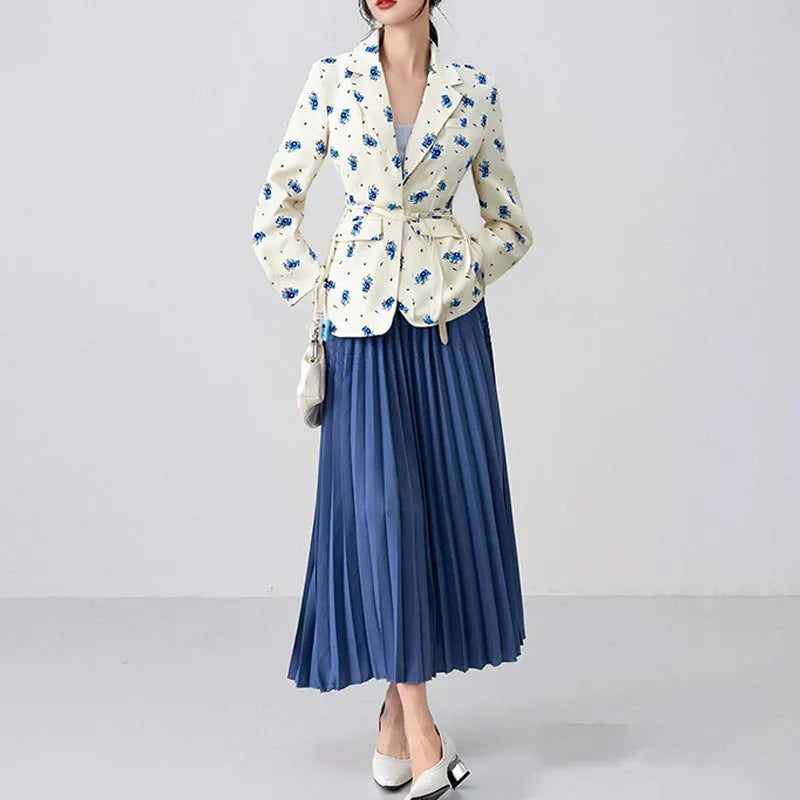 White suit jacket with a lace-up collar and a fitted waist on a model.