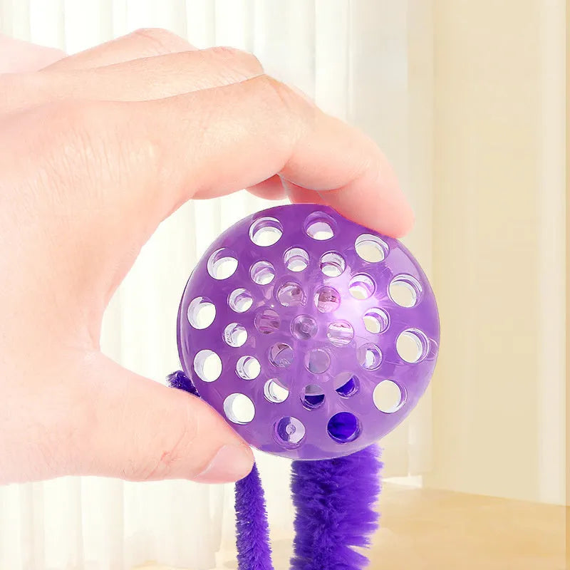 TPR interactive cat ball toy with attached worm tail in green, pink or purple colours