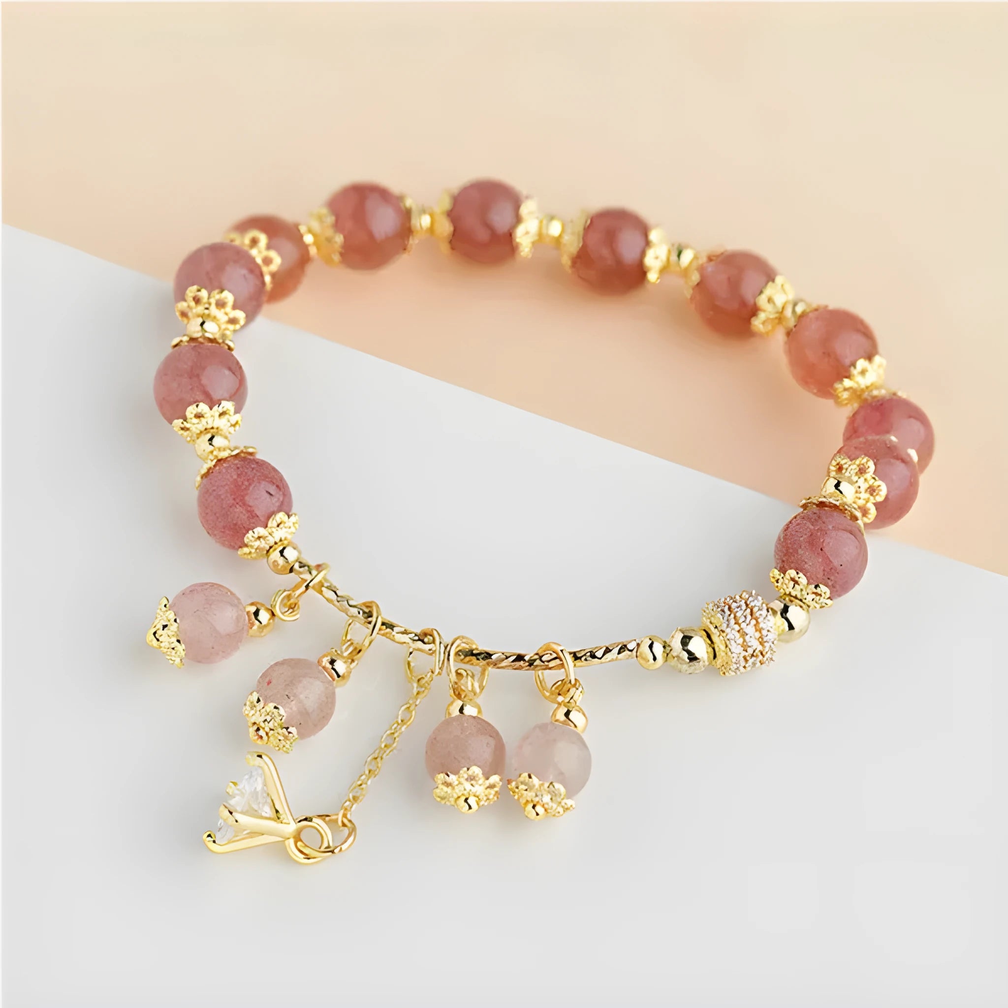 Pink crystal women's bracelet with heart-shaped charms and pearl decorative accents
