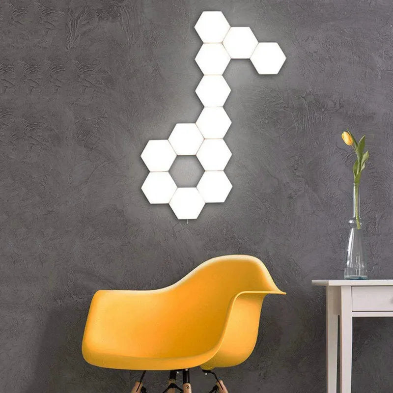 Close up of a modular hexagon LED wall light in a honeycomb pattern with multiple colour panels
