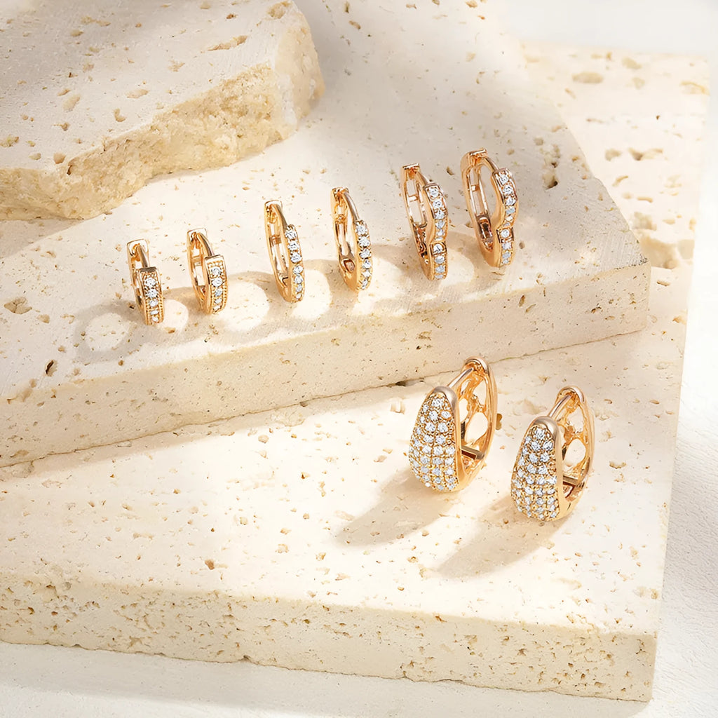 Brass gold plated heart shaped ear clip earrings with gang drill texture on copper construction