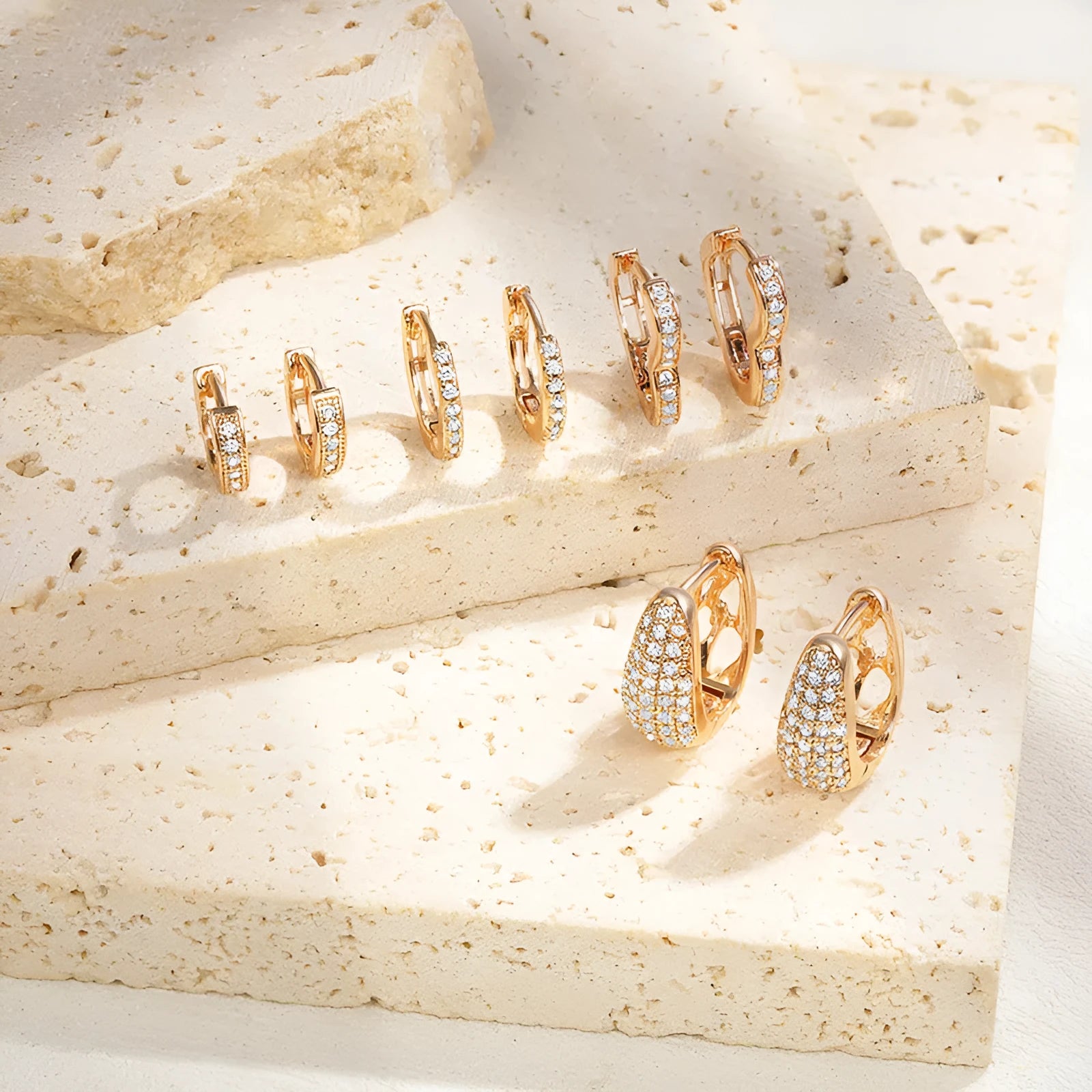 Brass gold plated heart shaped ear clip earrings with gang drill texture on copper construction