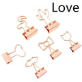 Gold-coloured long tail metal clip with a choice of flamingo, love, clouds, cat, cactus, or bow decorative design.