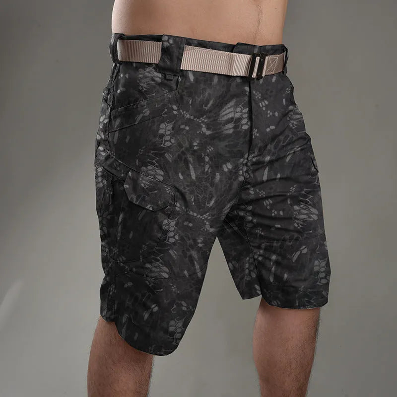 Men's khaki tactical shorts with button closure for hiking and outdoor work.