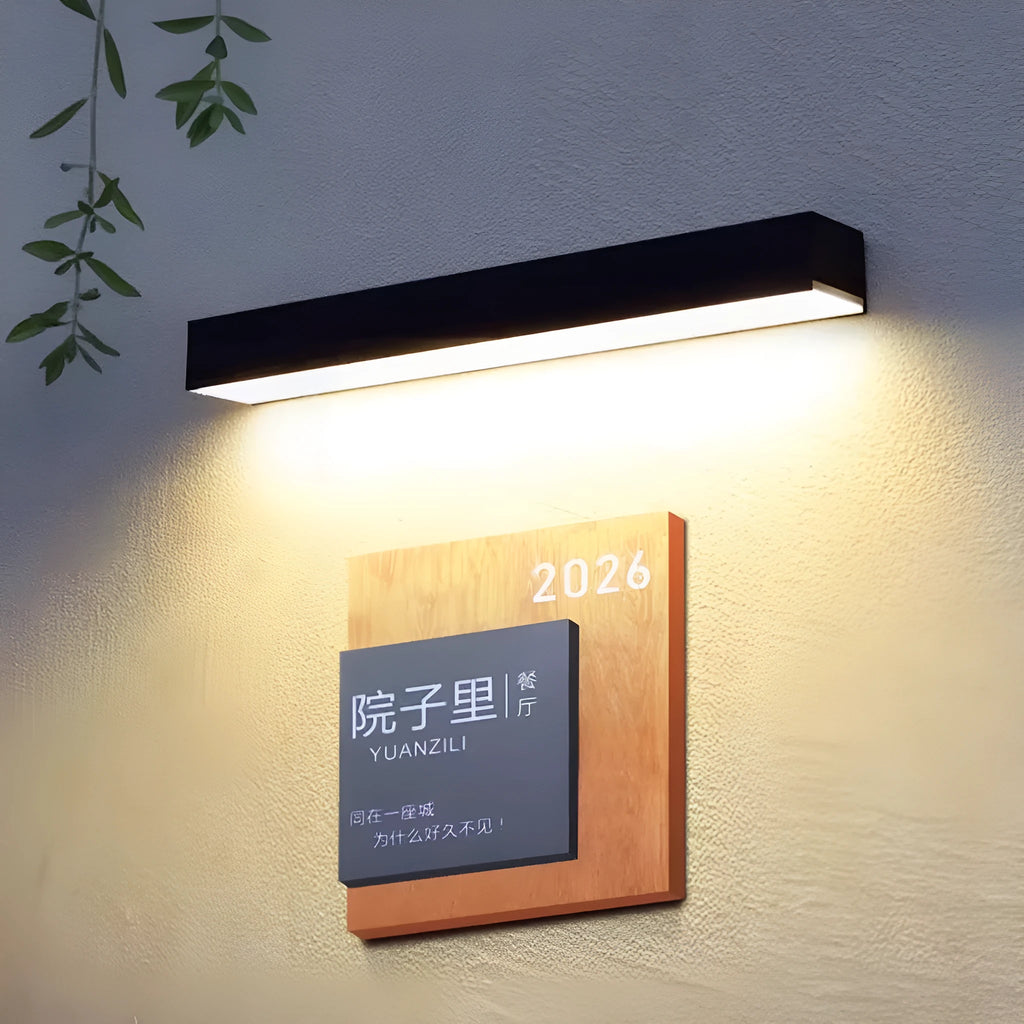 Black solar-powered outdoor wall lamp with integrated solar panel and LED light.