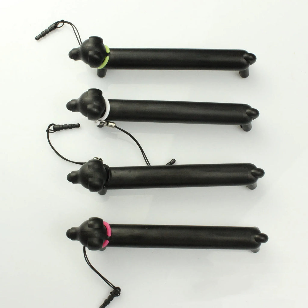 Black dog-shaped touch screen stylus shown with phone holder configuration