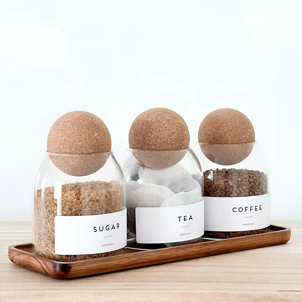 Three transparent glass spherical food storage tanks arranged on a shelf with modern simple design