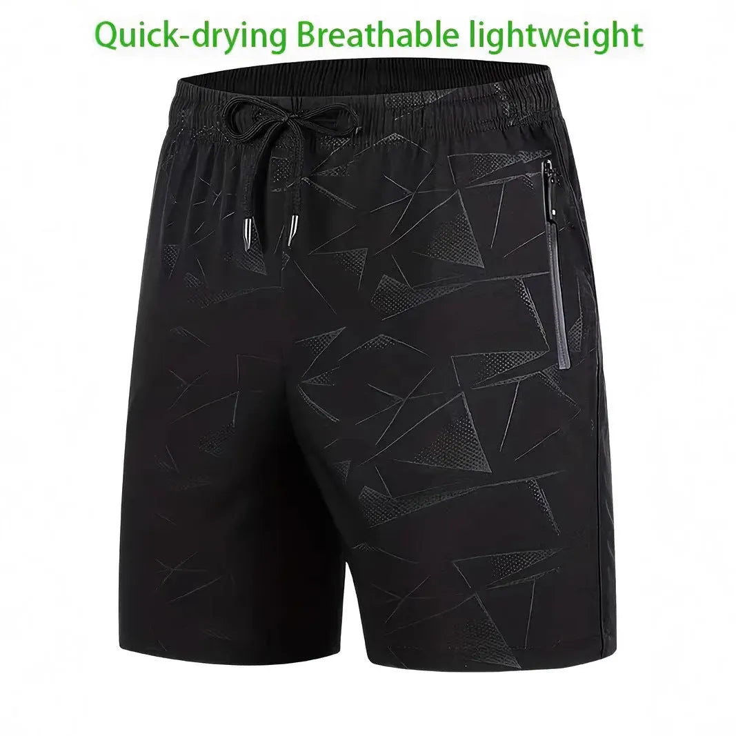 A pair of men's loose-fitting black sports shorts with an elasticated waistband, laid flat.