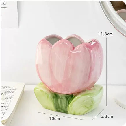 Ceramic pen holder storage box with floral pattern decoration on desktop