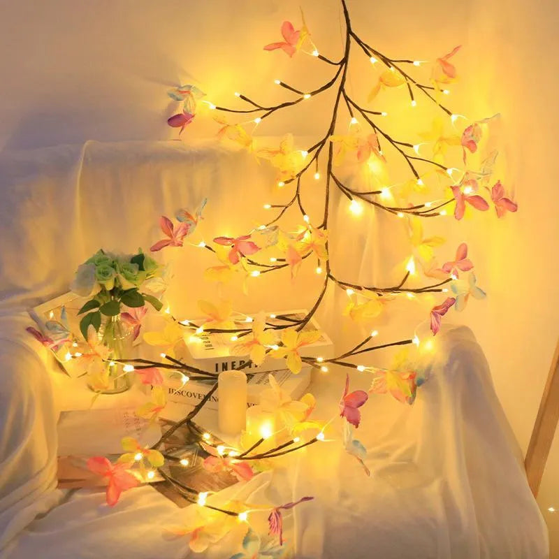 Flexible LED butterfly tree rattan lamp shaped into a decorative spiral, showing USB cable and lit white LEDs.