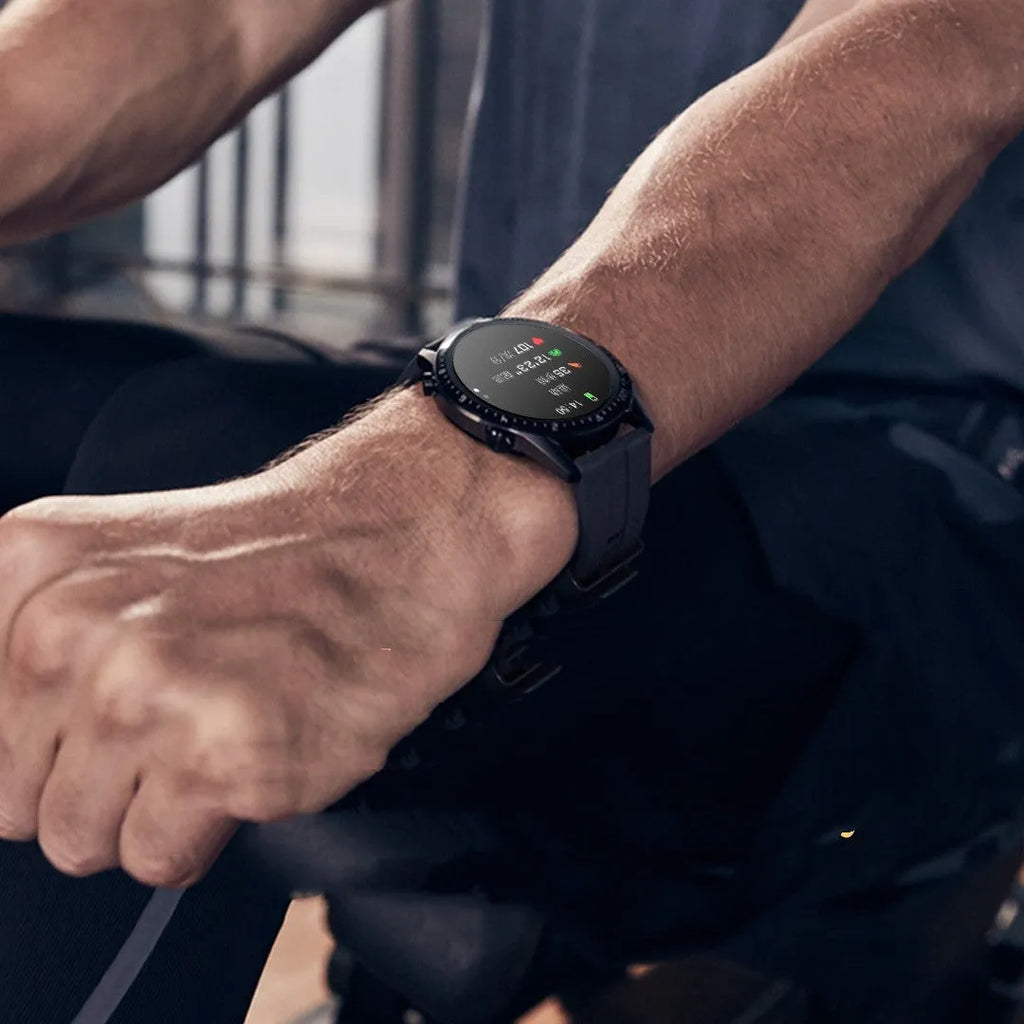 Round smartwatch with Bluetooth calling on wrist, showing black aluminium alloy case and touchscreen display