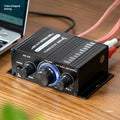Mini small amplifier black 20W stereo with RCA input and cable clip outputs for home computer audio