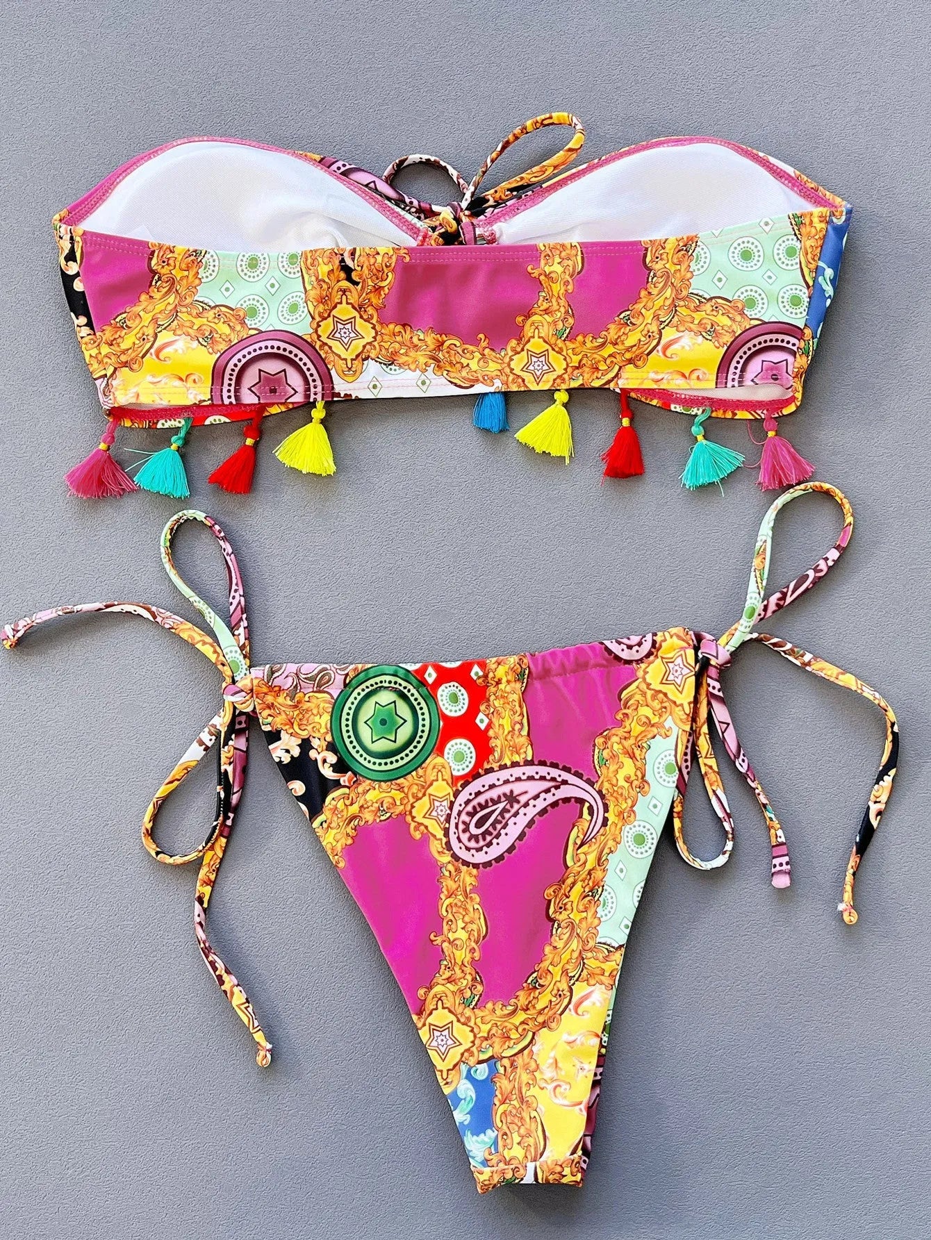 Women's printed polyester separated bikini set with tube top and briefs for swimming.