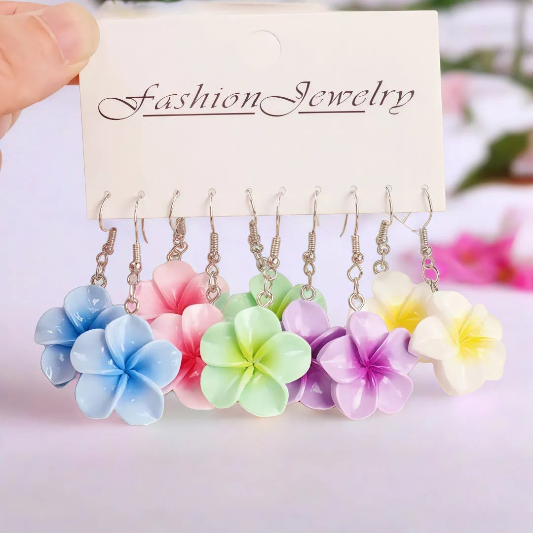 Handmade resin Plumeria Rubra earrings in seven colours including pink, blue, purple, white, green, yellow, and rose red