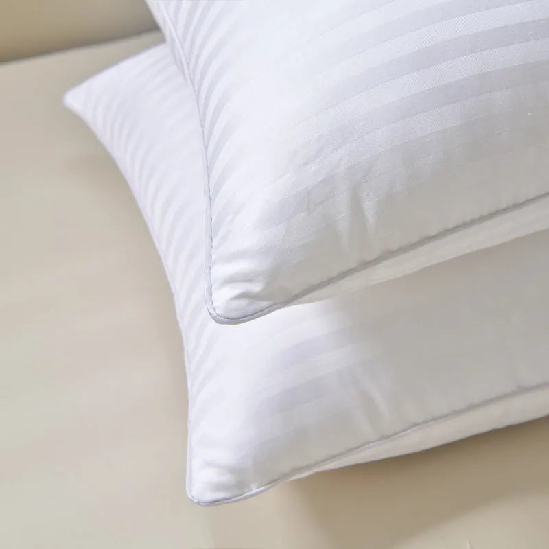 White cotton satin stripe pillow with a feather cotton fill, shown in low, medium, and high loft options.