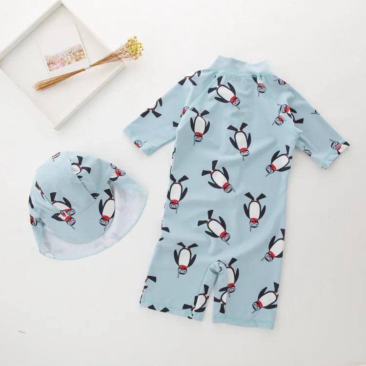 Boys' penguin print two-piece swim set with long sleeve rash guard top and matching swimming cap