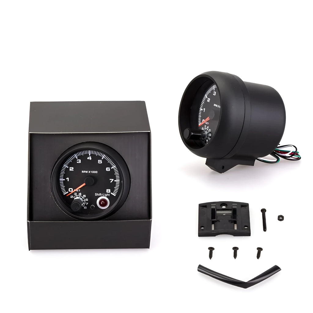 Black automotive digital tachometer with blue laser pointer for engine RPM measurement