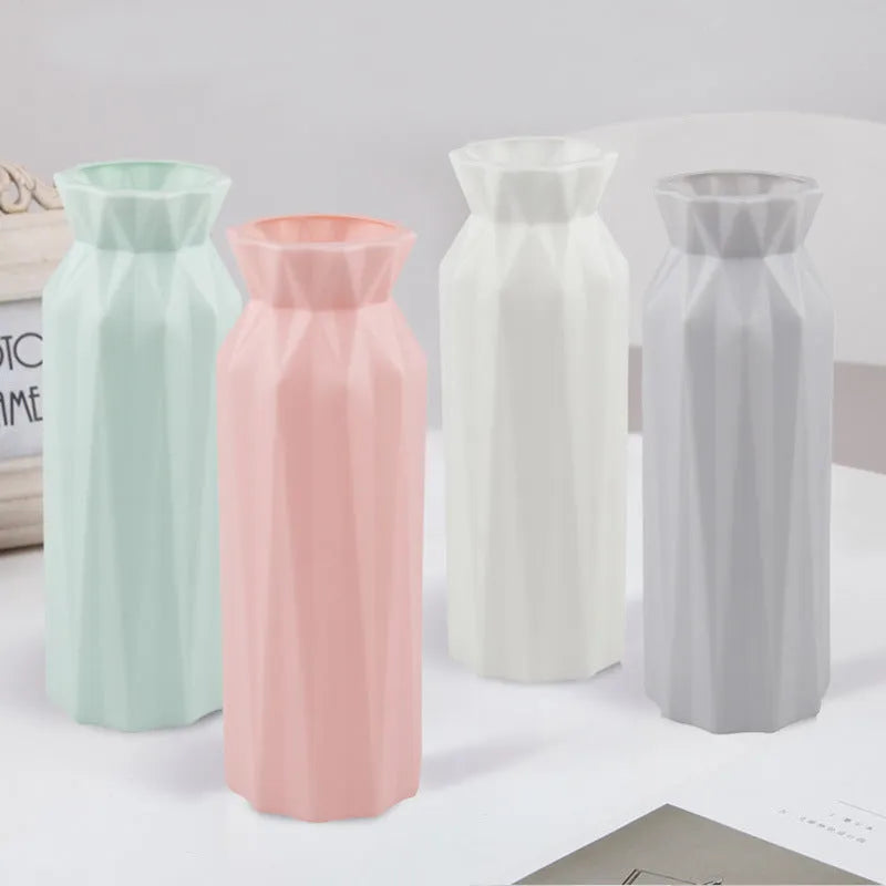 Drop-resistant plastic melamine vase in green, grey, pink, or white colour on a table.