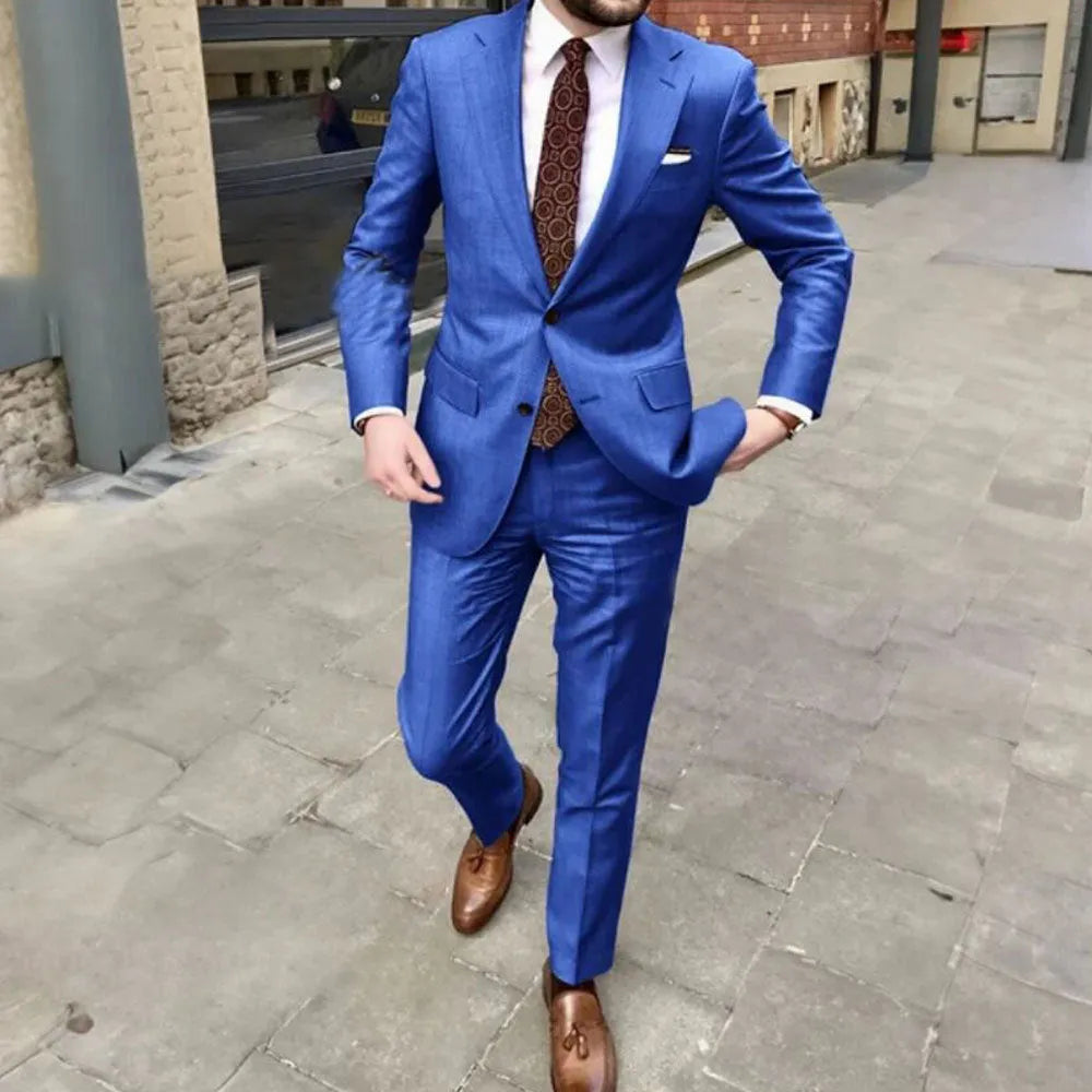 Men's slim fit two-button business suit jacket and trousers on a hanger
