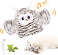 Grey automatic chirping owl cat toy with flapping wings on a flat surface.