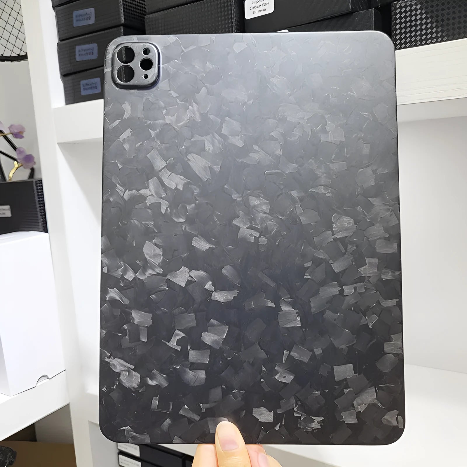 Carbon fibre hard protective case for iPad Pro 11 showing plaid weave pattern in a choice of three finishes.