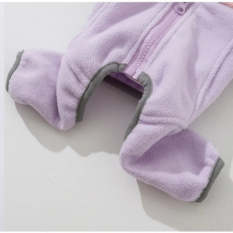 Four-legged fleece jacket for cats and small dogs in colour block design with badge patch, showing front zipper and elastic cuffs.