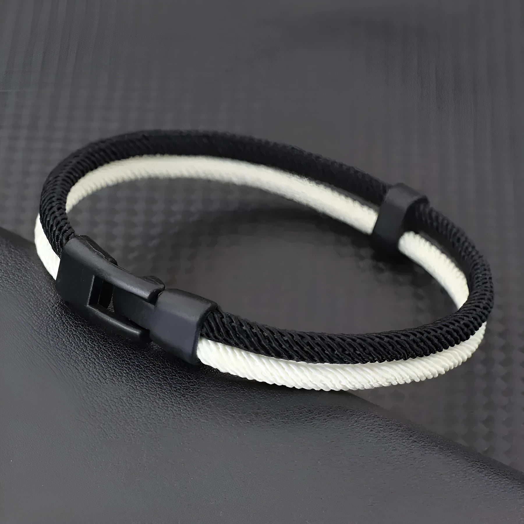 Simple casual handmade woven hand strap in black and white colour scheme