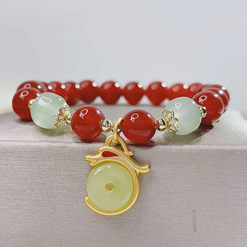 Handmade red agate bracelet with dragon design for women, Chinese style.