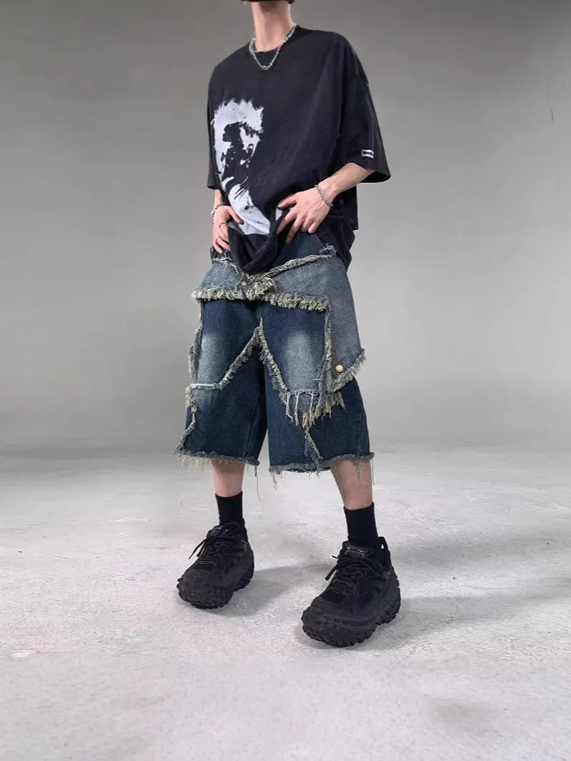 Men's blue denim shorts with frayed five-pointed star detailing and loose fit design
